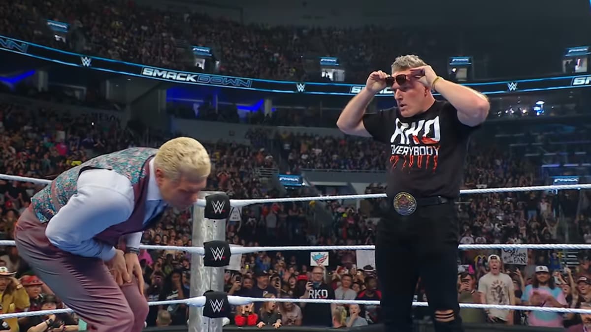 Pat McAfee looking at Cody Rhodes while holding his sunglasses down on WWE SmackDown 