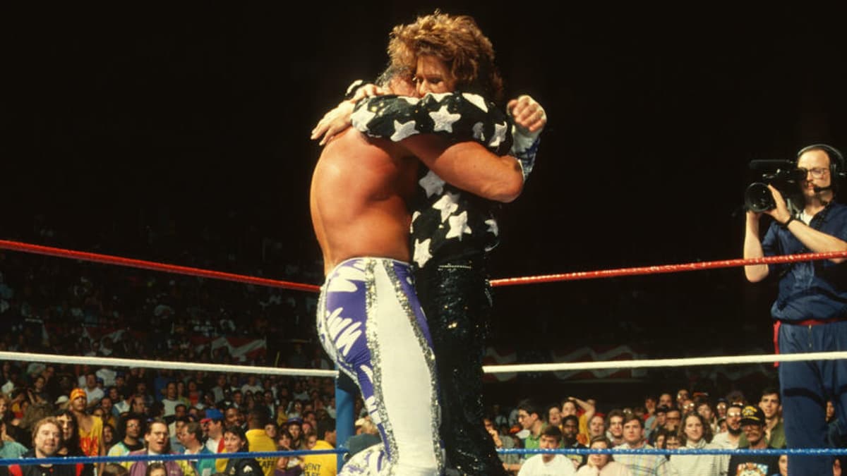 Randy Savage and Miss Elizabeth hugging at WWE WrestleMania VII