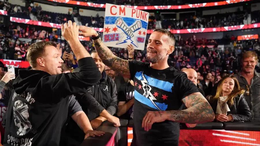 CM Punk November 2023 high fives all around.jpg