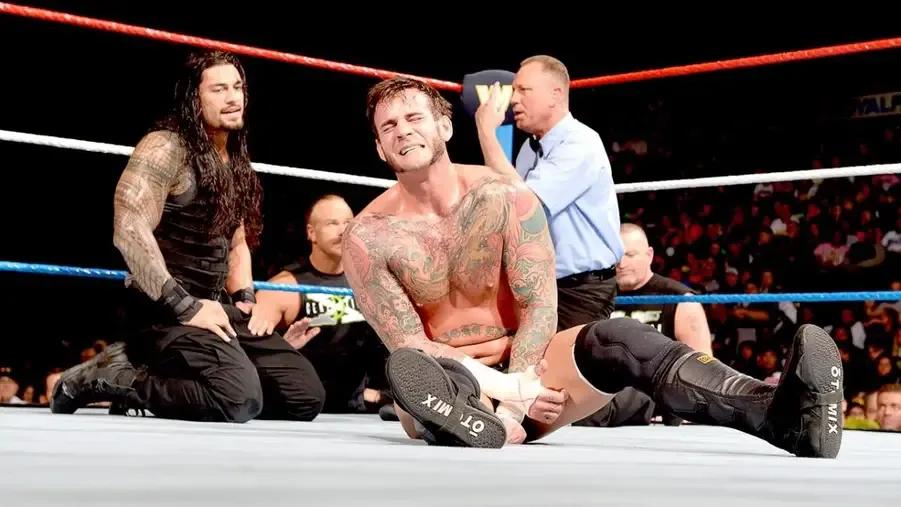 CM Punk- Roman Reigns- WWE Raw 2014.jpg