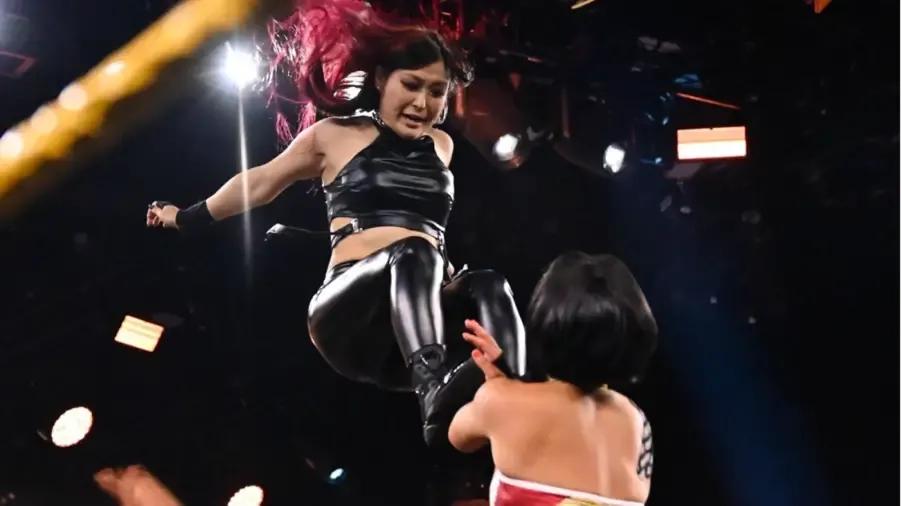 Io Shirai dropkick to Bayley.jpg