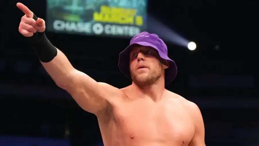 Jake Hager purple hat pointing.jpg