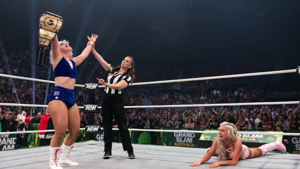 Toni Storm celebrating as Mariah May cries on the mat