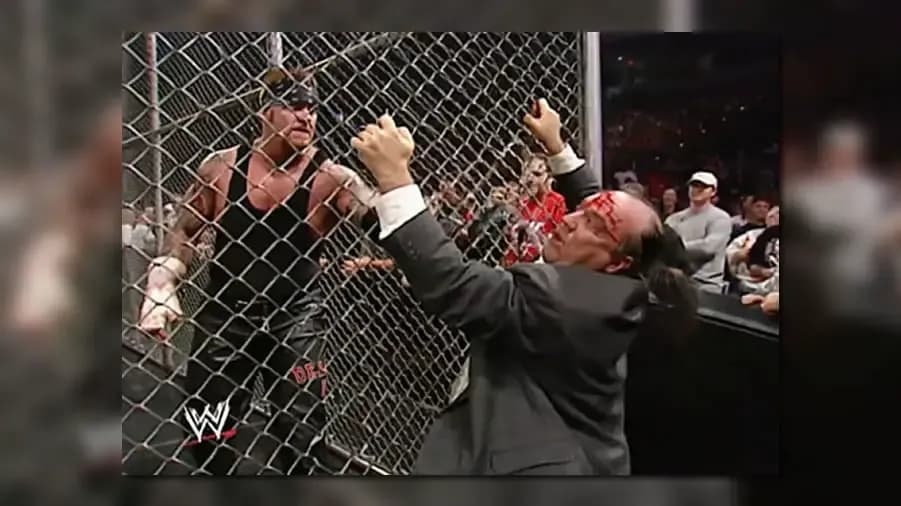 https://cultaholic.com/files/images/bc6fe4ba435ac01535b562baa846a475637aa005-the-undertaker-paul-heyman-hell-in-a-cell-no-mercy-2002.jpg